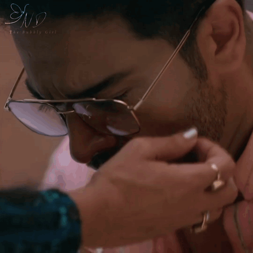A Man Wearing Glasses Is Being Touched By A Woman 'S Hand And The Words Look At Me Are On The Bottom GIF