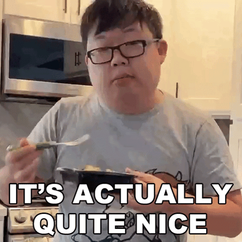 A Man Wearing Glasses Is Holding A Plate Of Food And Saying It 'S Actually Quite Nice GIF