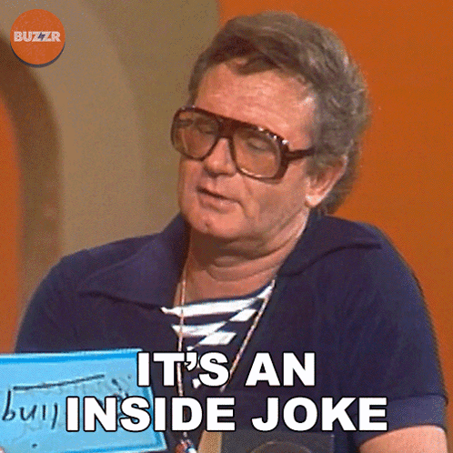 A Man Wearing Glasses Is Holding A Sign That Says It 'S An Inside Joke GIF