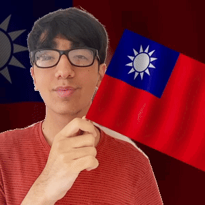 A Man Wearing Glasses Is Holding A Small Flag In Front Of A Taiwan Flag GIF