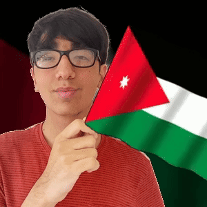 A Man Wearing Glasses Is Holding A Small Flag In Front Of His Face GIF