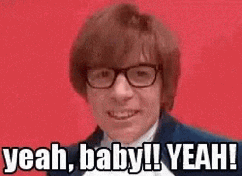 A Man Wearing Glasses Is Making A Funny Face And Saying Yeah Baby ! Yeah ! GIF