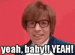 A Man Wearing Glasses Is Making A Funny Face And Saying Yeah , Baby ! Yeah ! GIF
