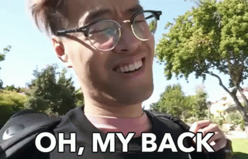 A Man Wearing Glasses Is Smiling And Says Oh My Back GIF