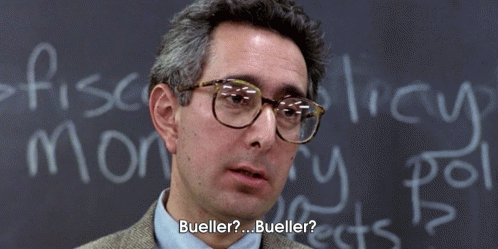 A Man Wearing Glasses Is Standing In Front Of A Chalkboard That Says Bueller GIF