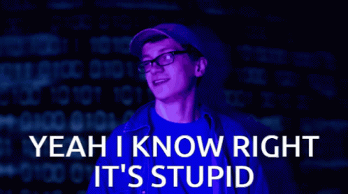 A Man Wearing Glasses Is Standing In Front Of A Computer Screen That Says Yeah I Know Right It 'S Stupid GIF