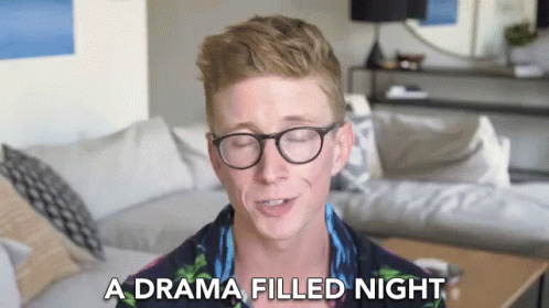 A Man Wearing Glasses Is Talking About A Drama Filled Night GIF
