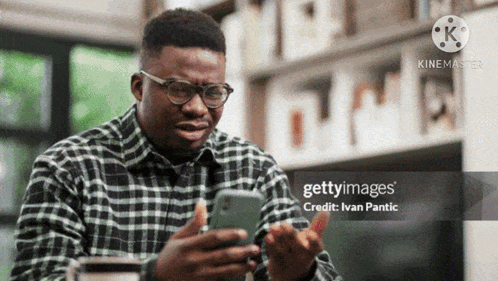 Man Wearing Glasses Using Cell Phone GIF