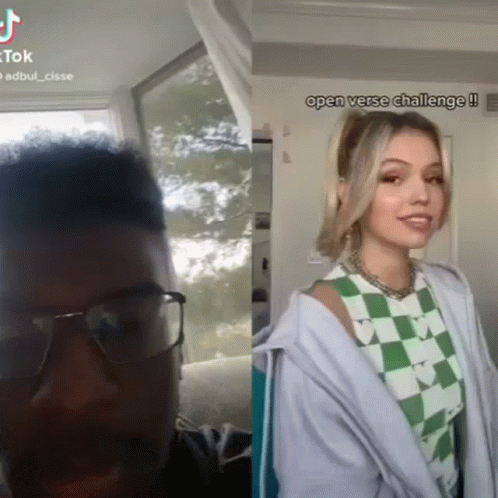 A Man Wearing Glasses Next To A Woman Wearing A Green And White Checkered Shirt .. GIF