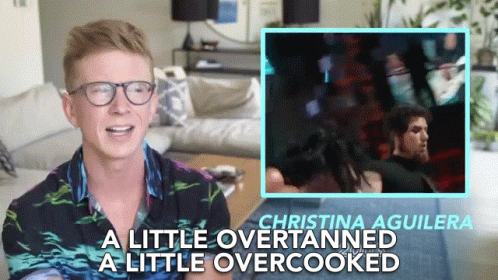 A Man Wearing Glasses Says Christina Aguilera A Little Over Tanned A Little Overcooked GIF