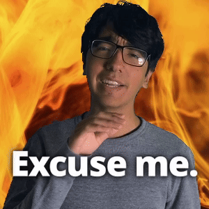 A Man Wearing Glasses Says Excuse Me In Front Of A Flaming Background GIF