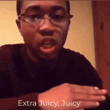 A Man Wearing Glasses Says Extra Juicy Juicy In Front Of His Face GIF