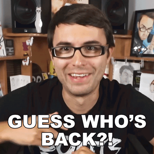 A Man Wearing Glasses Says " Guess Who 'S Back ? " GIF