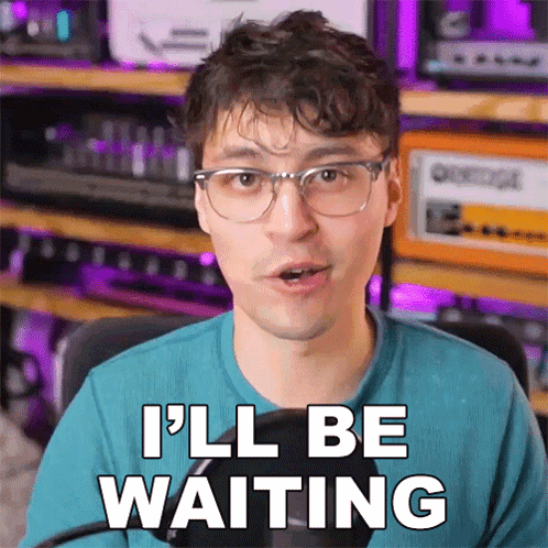 A Man Wearing Glasses Says " I 'Ll Be Waiting " GIF