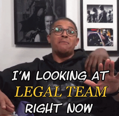 A Man Wearing Glasses Says I 'M Looking At Legal Team Right Now In Yellow Letters GIF