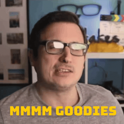 A Man Wearing Glasses Says " Mmmm Goodies " In Yellow GIF