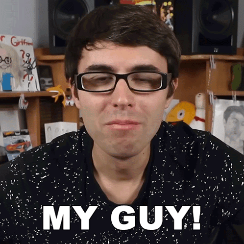 A Man Wearing Glasses Says " My Guy " In Front Of His Face GIF