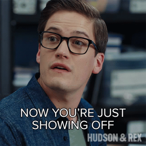 A Man Wearing Glasses Says " Now You 'Re Just Showing Off Hudson & Rex " GIF