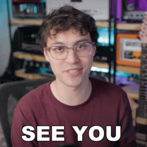 A Man Wearing Glasses Says See You In Front Of A Guitar GIF