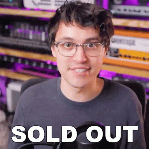 A Man Wearing Glasses Says Sold Out In Front Of A Purple Background GIF