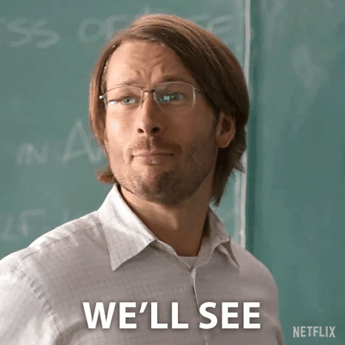 A Man Wearing Glasses Says We 'Ll See In Front Of A Green Board GIF