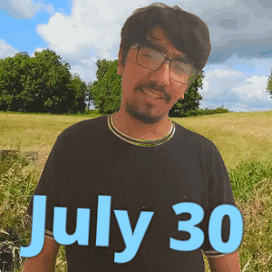 A Man Wearing Glasses Stands In A Field With The Date July 30 GIF