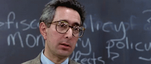 A Man Wearing Glasses Stands In Front Of A Chalkboard That Says Bueller GIF