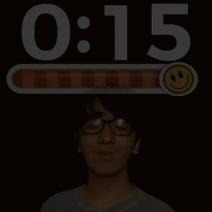 A Man Wearing Glasses Stands In Front Of A Screen That Says 0:06 And A Smiley Face GIF