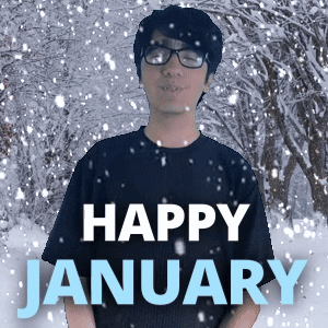 A Man Wearing Glasses Stands In Front Of A Snowy Forest With The Words Happy January Written Below Him GIF