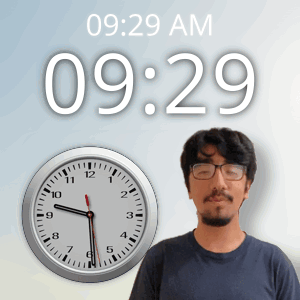 a man wearing glasses stands in front of a wall clock that says 10:29 am
