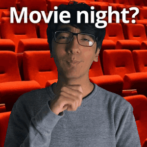 a man wearing glasses stands in front of rows of red seats with the words movie night written above him