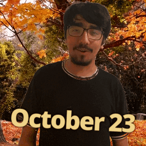 A Man Wearing Glasses Stands In Front Of Trees With The Date October 23 GIF