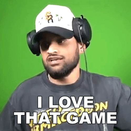 A Man Wearing Headphones And A Baseball Cap Says I Love That Game GIF