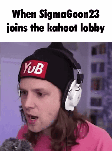 A Man Wearing Headphones And A Beanie With A Yub Patch On It . GIF