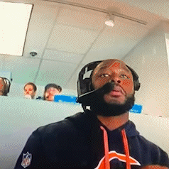 A Man Wearing Headphones And A Bears Shirt GIF