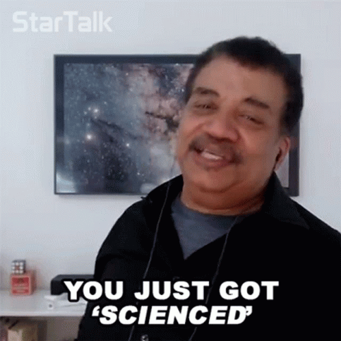 A Man Wearing Headphones And A Black Shirt Is Smiling And Saying `` You Just Got ' Scienced '' . GIF