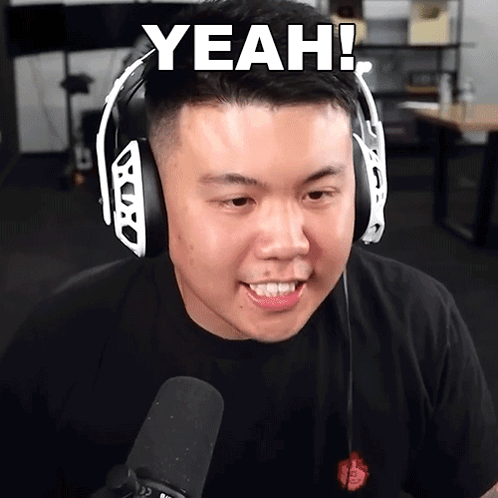 A Man Wearing Headphones And A Black Shirt Says " Yeah " GIF