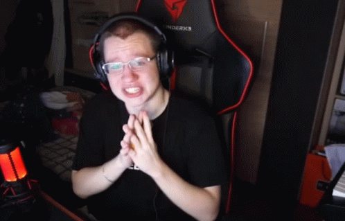 A Man Wearing Headphones And A Black Shirt That Says #Freebat On It GIF