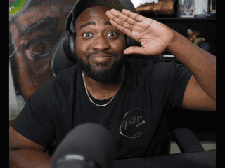 A Man Wearing Headphones And A Black Shirt That Says Pulse GIF