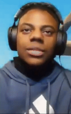 a man wearing headphones and a blue adidas hoodie