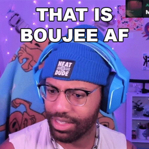 A Man Wearing Headphones And A Blue Beanie That Says Neat Dude GIF