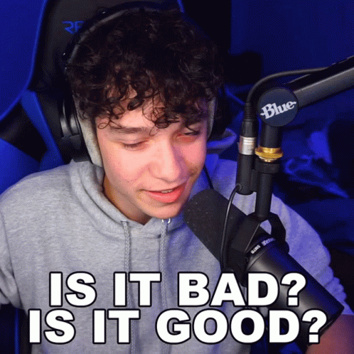 A Man Wearing Headphones And A Blue Microphone Says " Is It Bad " GIF