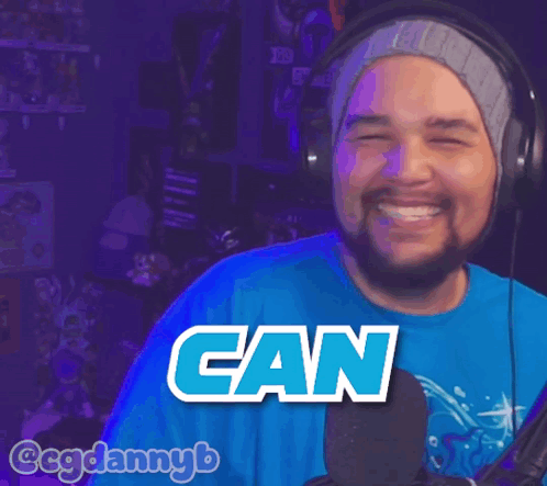A Man Wearing Headphones And A Blue Shirt That Says Getta On It GIF