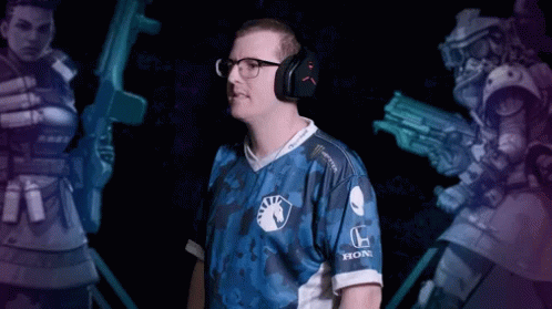 A Man Wearing Headphones And A Blue Shirt With The Word Honda On The Sleeve GIF