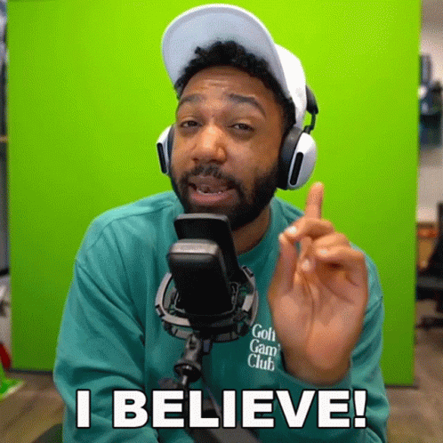A Man Wearing Headphones And A Green Shirt Says I Believe In Front Of A Green Screen GIF