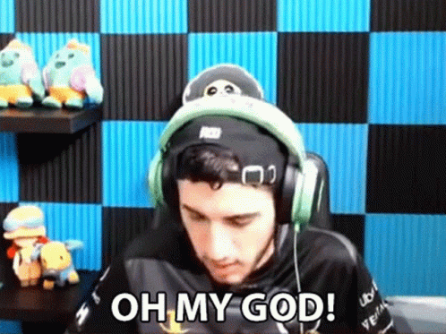 A Man Wearing Headphones And A Hat Is Sitting In Front Of A Checkered Wall And Says `` Oh My God '' . GIF