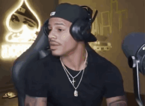 Man With Headphones And Hat In Front Of Microphone GIF
