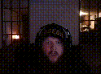 A Man Wearing Headphones And A Hat That Says " Aeon " GIF