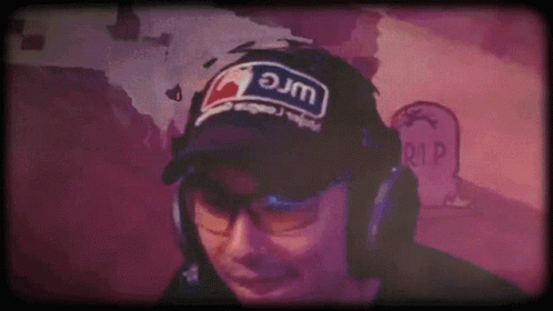 A Man Wearing Headphones And A Hat That Says Jm GIF