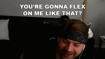 A Man Wearing Headphones And A Headband Is Sitting On A Couch And Talking To Someone . GIF